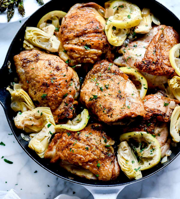 How to Eat for Hormones, Energy & Weight Loss in Your 30s and 40s. Roast chicken with artichoke dish on a round dish.