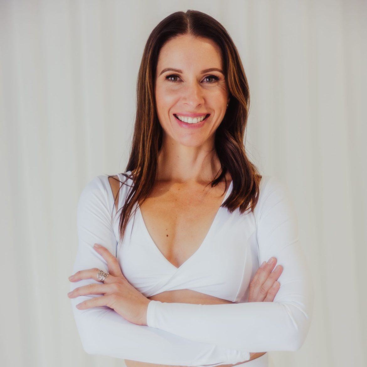 Tara Lori smiling with radiant, natural skin exploring Botox alternatives for healthy aging and hormone balance.