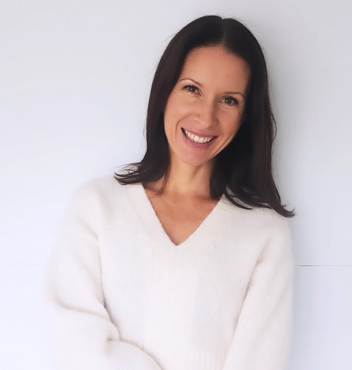 Tara Lori smiling with radiant, natural skin exploring Botox alternatives for healthy aging and hormone balance.